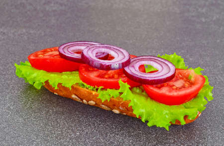 Healthy eating: Fresh sandwich with lettuce, tomato and onion. Studio Photoの写真素材