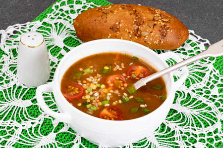 Spicy soup with curry, chili, cereals, rice and vegetables. Studio Photo
