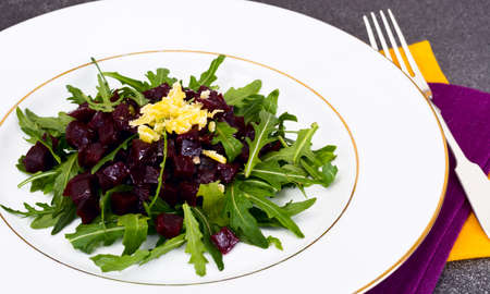 Dietary food without meat: Rocket salad, baked beetroot, cheese and vegetable oil. Studio Photoの写真素材