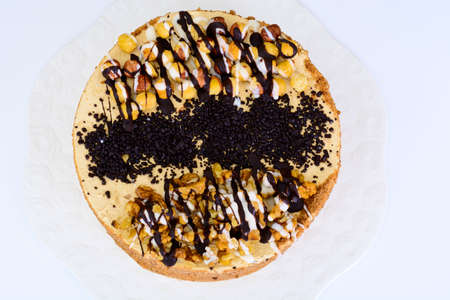 Sweets: delicious fresh cake with nuts. Studio Photo