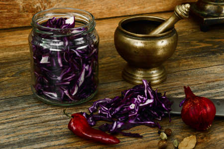 Red Cabbage on Wood Background with Knife. Studio Photo