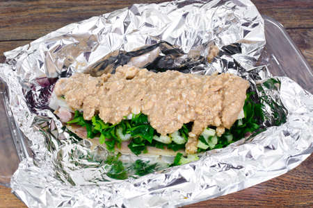 Mackerel Stuffed with Celery and Parsley in a Sauce of Coconut Milk, Oyster and Soy Sauceの写真素材