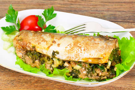 Mackerel Stuffed with Celery and Parsley in a Sauce of Coconut Milk, Oyster and Soy Sauceの写真素材
