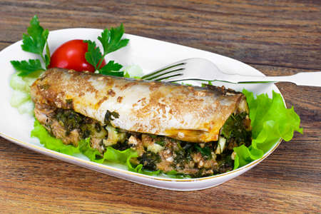 Mackerel Stuffed with Celery and Parsley in a Sauce of Coconut Milk, Oyster and Soy Sauceの写真素材
