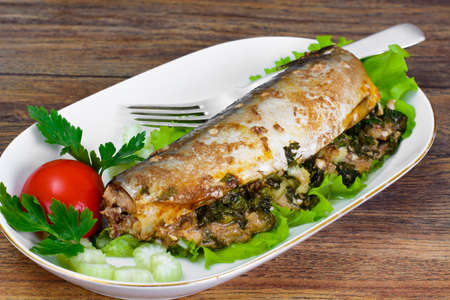 Mackerel Stuffed with Celery and Parsley in a Sauce of Coconut Milk, Oyster and Soy Sauceの写真素材