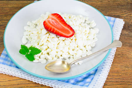 Home Dietary Fat Cottage Cheese Beaded Curd with Strawberry Studio Photoの写真素材