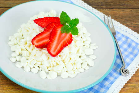 Home Dietary Fat Cottage Cheese Beaded Curd with Strawberry Studio Photoの写真素材