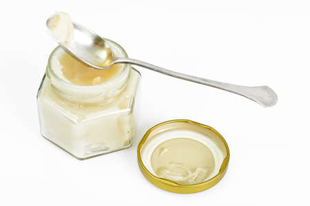 Glass Jar with Cream Honey Bee Studio Photoの写真素材