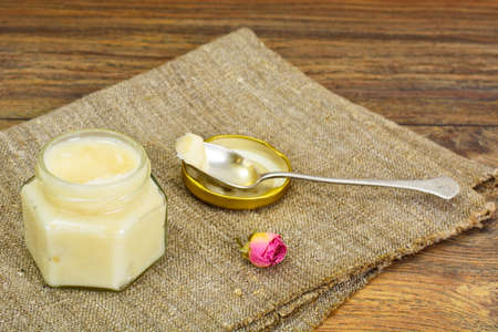 Glass Jar with Cream Honey Bee Studio Photoの写真素材