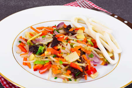 Healthy, diet: Mushrooms mun, bamboo shoots, soy sprouts, peppers and leeks with squid Studio Photoの写真素材