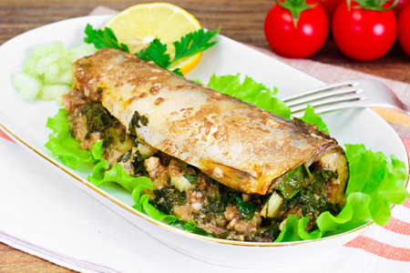 Mackerel Stuffed with Celery and Parsley in a Sauce of Coconut Milk, Oyster and Soy Sauceの写真素材