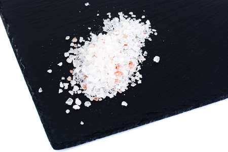 Pink Salt in Black Stone Background Studio Photoの写真素材