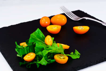 Salad of Wild Garlic with Kumquats Studio Photoの写真素材