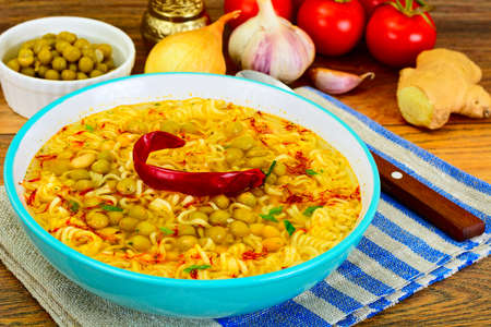 Healthy and diet food: White beans, canned peas, noodles, saffron. Studio Photo