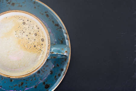 Coffee with milk, cappuccino in a blue retro cup. Studio Photoの写真素材