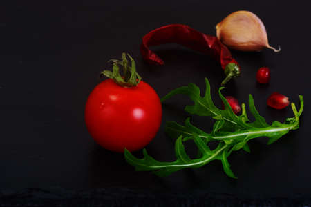 Healthy and diet food: arugula and tomato. Studio Photoの写真素材