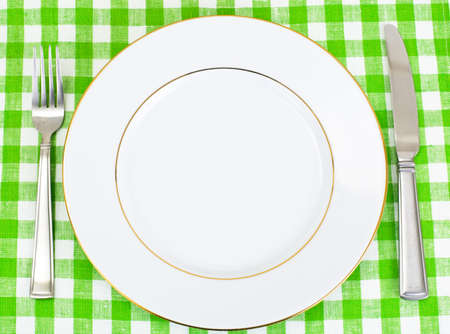 White Plate on a Checkered Tablecloth with Place for Your Text Studio Photo