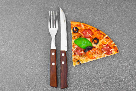 Pepperoni Pizza with Sausage, Cheese, Mozzarella, Olives and Basil Studio Photoの写真素材