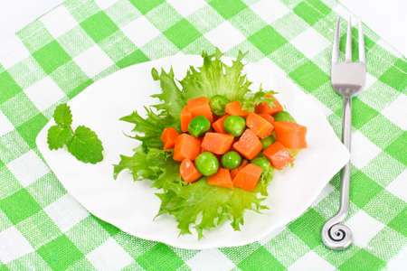 Juicy Vegetable Stew. Lettuce, Peas and Carrots. Diet Food. Studio Photoの写真素材