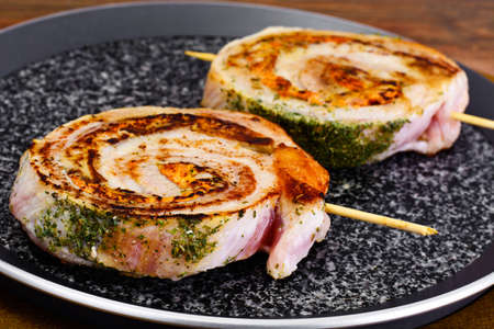 Roll of Bacon with Mushrooms, Carrots, Greens, Barbecue Grill. Studio Photoの写真素材
