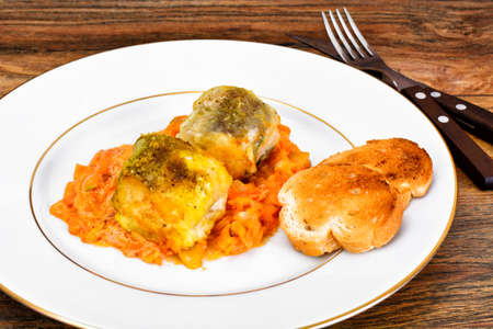 Fish in Greek with Onion and Carrot Studio Photo