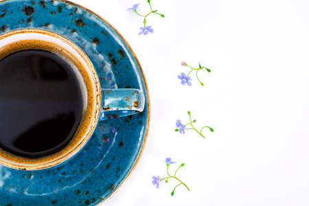 Coffee  in a blue retro cup with Flowers. Studio Photoの写真素材