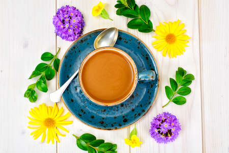 Coffee  in a blue retro cup with Flowers. Studio Photoの写真素材