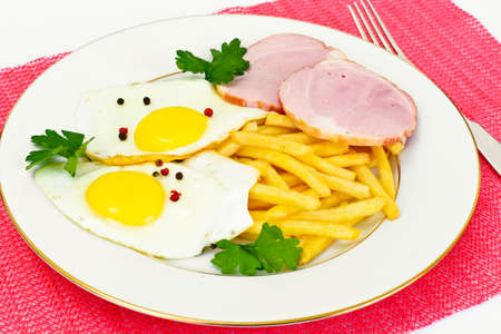 French Fries with Scrambled Eggs, Ham, Ketchup Studio Photoの写真素材