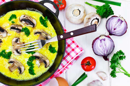 Healthy and Diet Food: Scrambled Eggs with Mushrooms and Vegetables. Studio Photoの写真素材