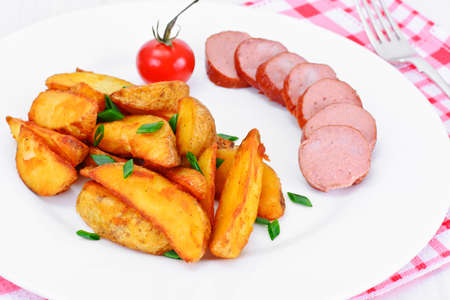 Fried Potato Wedges in a Rural and Sausage Studio Photoの写真素材