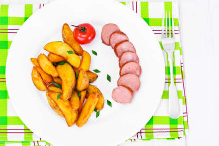 Fried Potato Wedges in a Rural and Sausage Studio Photoの写真素材