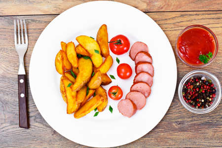 Fried Potato Wedges in a Rural and Sausage Studio Photoの写真素材