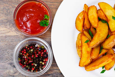 Fried Potato Wedges in a Rural and Sausage Studio Photo