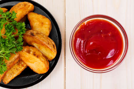 Potato Wedges, Potatoes in a Rural with Tomato Ketchup Studio Photo