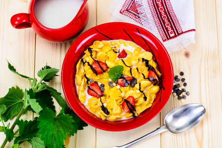 Cornflakes with Strawberry and Chocolate. Healthy Breakfast Studio Photo