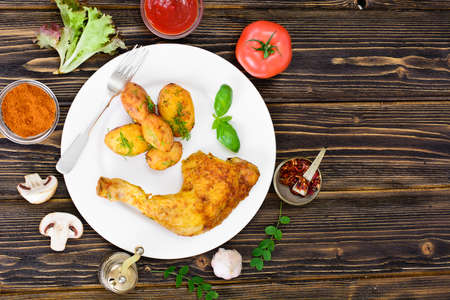 Potatoes Baked with Fennel and Grilled Chicken Leg Studio Photoの写真素材