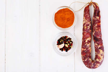 Homemade Dried Sausage on a Light Background Studio Photoの写真素材