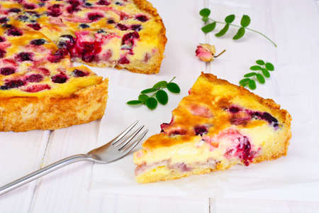 Cake with Strawberries, Blueberries, Currants and Raspberries, Creme Brulee on Rustic Boards Studio Photoの写真素材