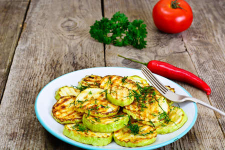 Zucchini Grilled with Fennel on Wooden Background Studio Photoの写真素材