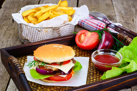 Burger on a Wooden Rustic Background Studio Photoの写真素材