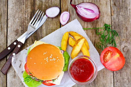 Burger on a Wooden Rustic Background Studio Photoの写真素材