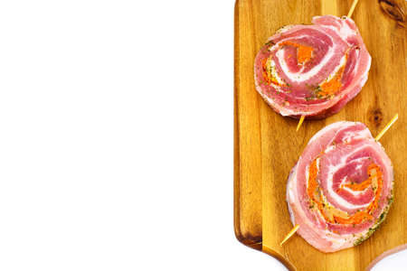 Roll of Bacon with Mushrooms, Carrots, Greens, Barbecue Grill. Studio Photoの写真素材