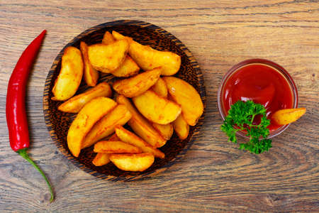Potato Wedges, Potatoes in a Rural with Tomato Ketchup Studio Photoの写真素材