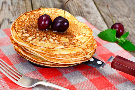 Tasty Pancakes Stack with Honey and Cherry Studio Photoの写真素材