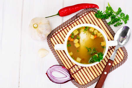 Broth of Turkey Fillet, Croutons on the White Boardsの写真素材