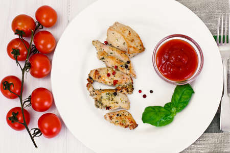 Grilled Chicken Fillet with Pepper, Basil and Tomato Studio Photoの写真素材
