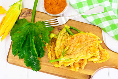 Flowers of Zucchini, Fried in Batter on a Wooden Background Studio Photoの写真素材