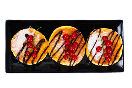 Cheesecakes with Chocolate and Red Currant Studio Photoの写真素材