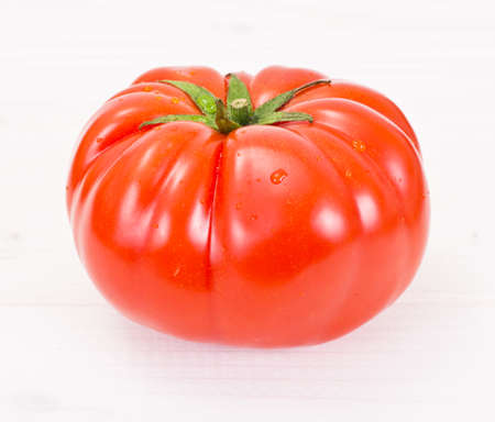 Red Tomatoes Isolated on a White Background Studio Photoの写真素材
