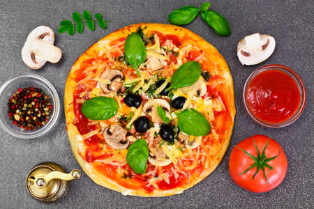 Pizza with Mushroom, Cheese, Mozzarella, Olives and Basil Studio Photoの写真素材